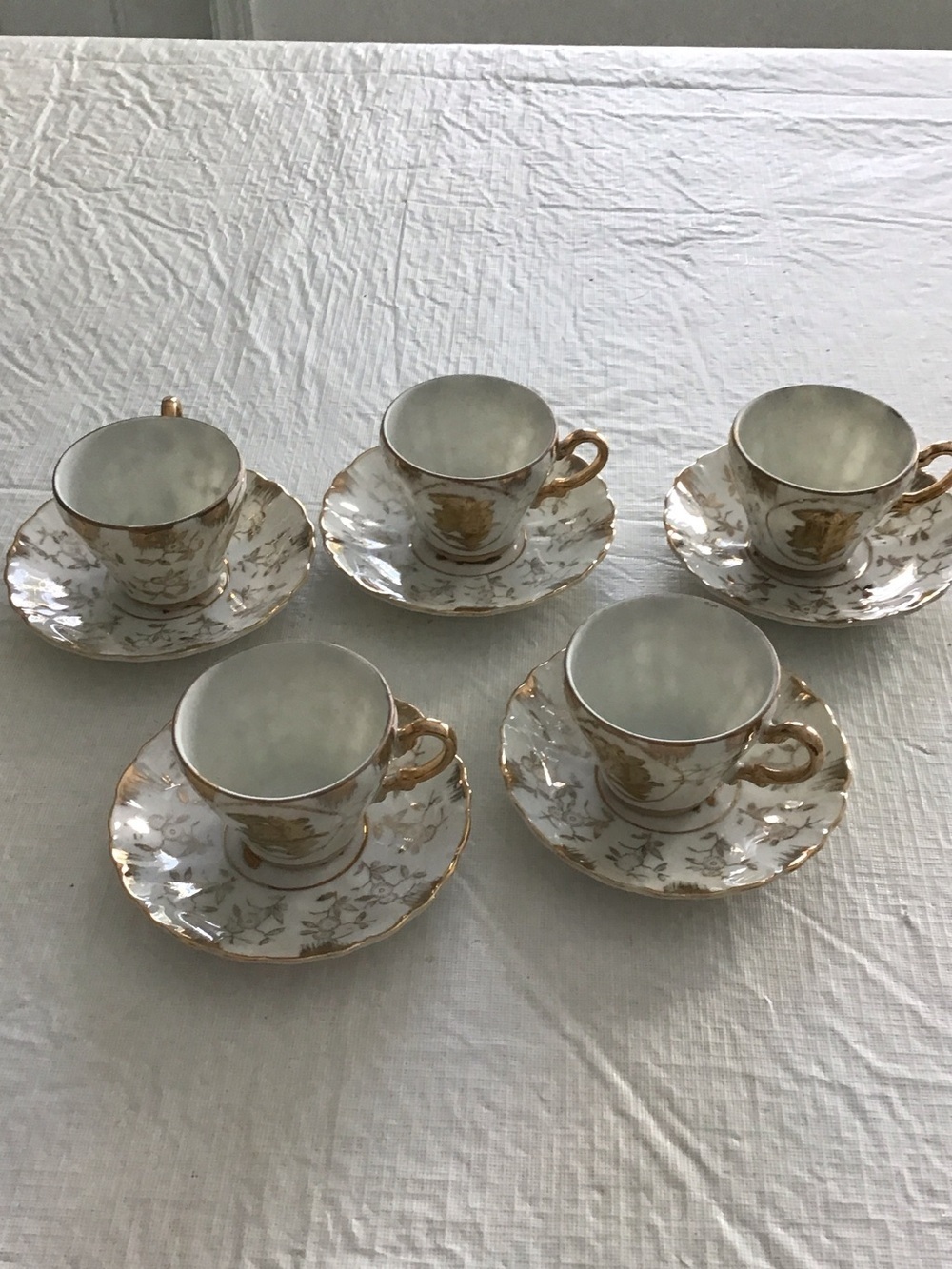 Vintage White and Gold Porcelain Demitasse cup and Saucer Set - Set of 5.  ##